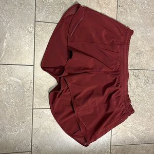 Lululemon Hotty Hot low rise 4” shorts. Mulled wine. Size 12.